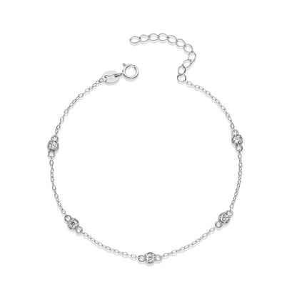 Silver bracelet with small diamond-like stones on a white background